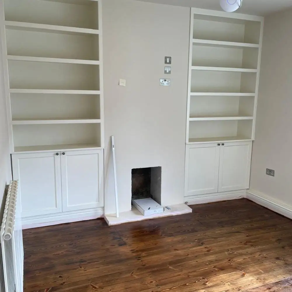 Alcove shelving either side of a fireplace