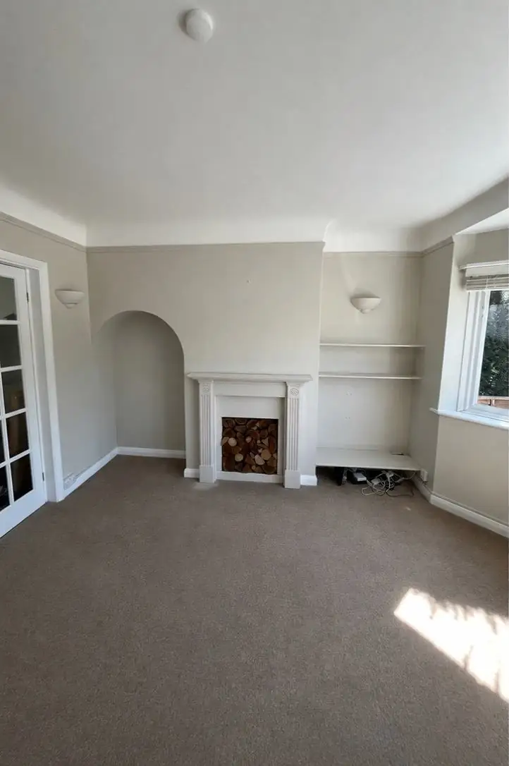 Fireplace wall and arch after plastering and decorating