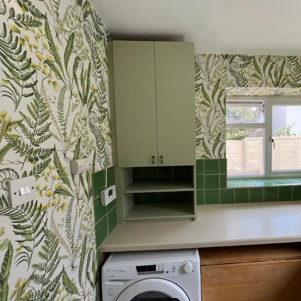Utility room with botanical feature wallpaper